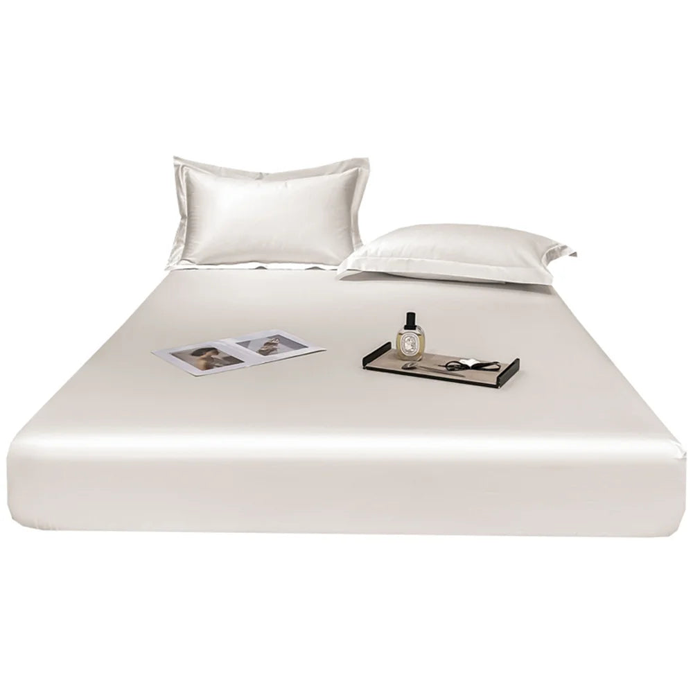 White satin sheet set on a bed with a white background