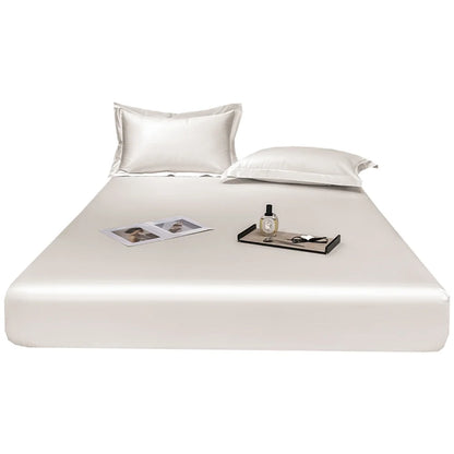 White satin sheet set on a bed with a white background