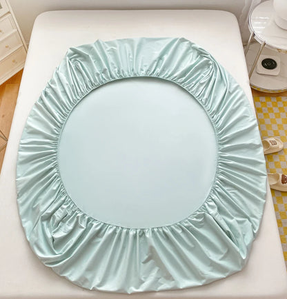 Light blue circular seat cover on a white surface