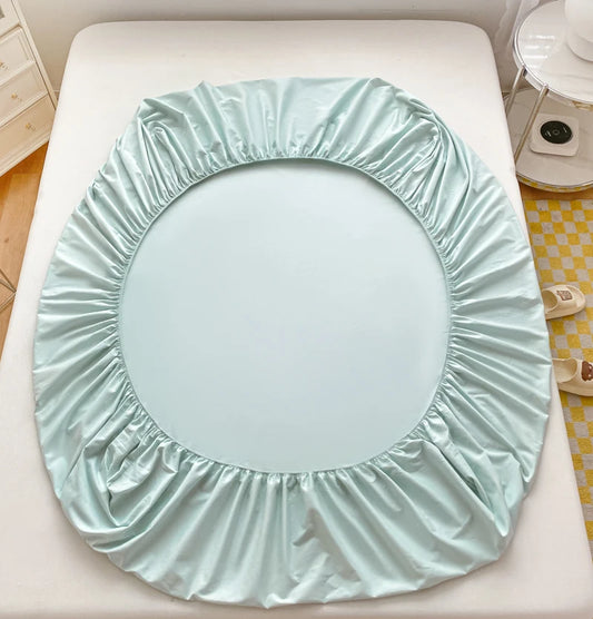 Light blue circular seat cover on a white surface