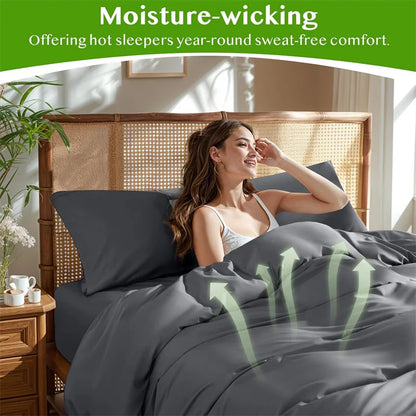 Woman lying in bed with gray bedding, text about moisture-wicking comfort.