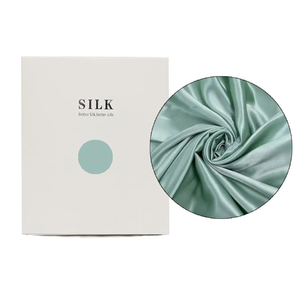 Silk fabric with a close-up detail and a branded box on a white background
