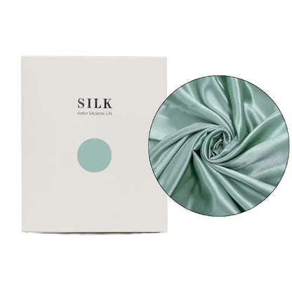 Silk fabric with a close-up detail and a branded box on a white background