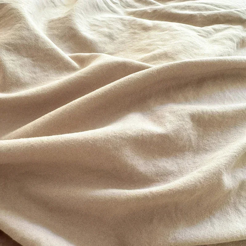 Close-up of beige fabric with folds
