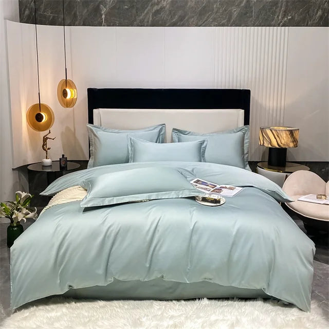 Bedroom with light blue bedding set on a bed, nightstands, and decorative items.