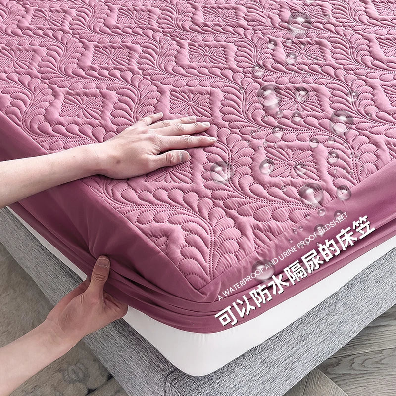 Pink quilted mattress cover being adjusted on a bed with text indicating waterproof and dustproof features.