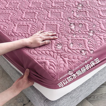 Pink quilted mattress cover being adjusted on a bed with text indicating waterproof and dustproof features.