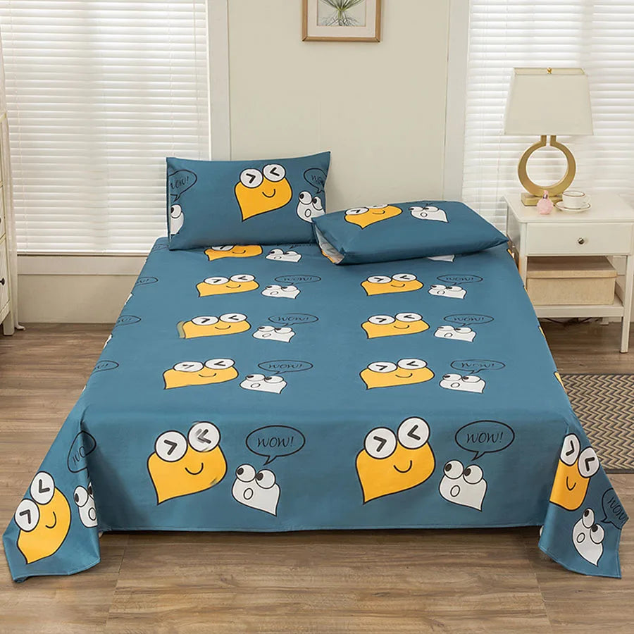 Blue bedspread with cartoon character design on a bed in a room with a lamp and window blinds.
