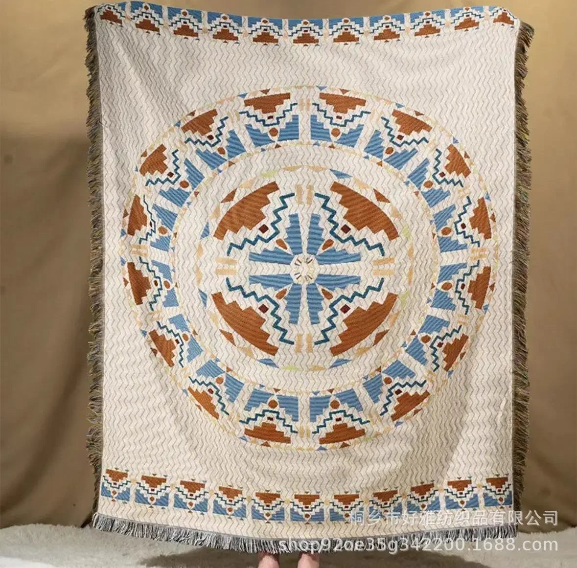Decorative blanket with geometric pattern on a beige background