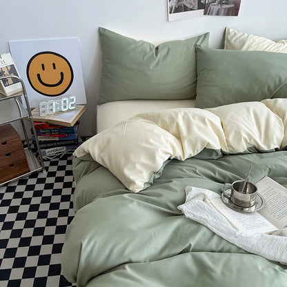 Bedroom with green bedding and a smiley face clock on the wall.