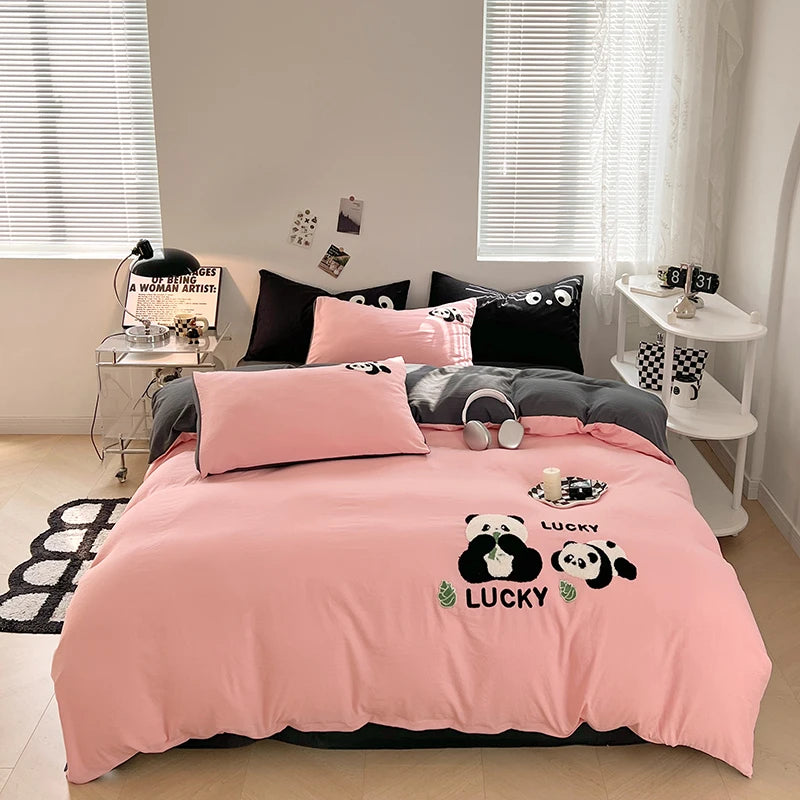 Bedroom with pink bedding featuring panda design and 'Lucky' text.
