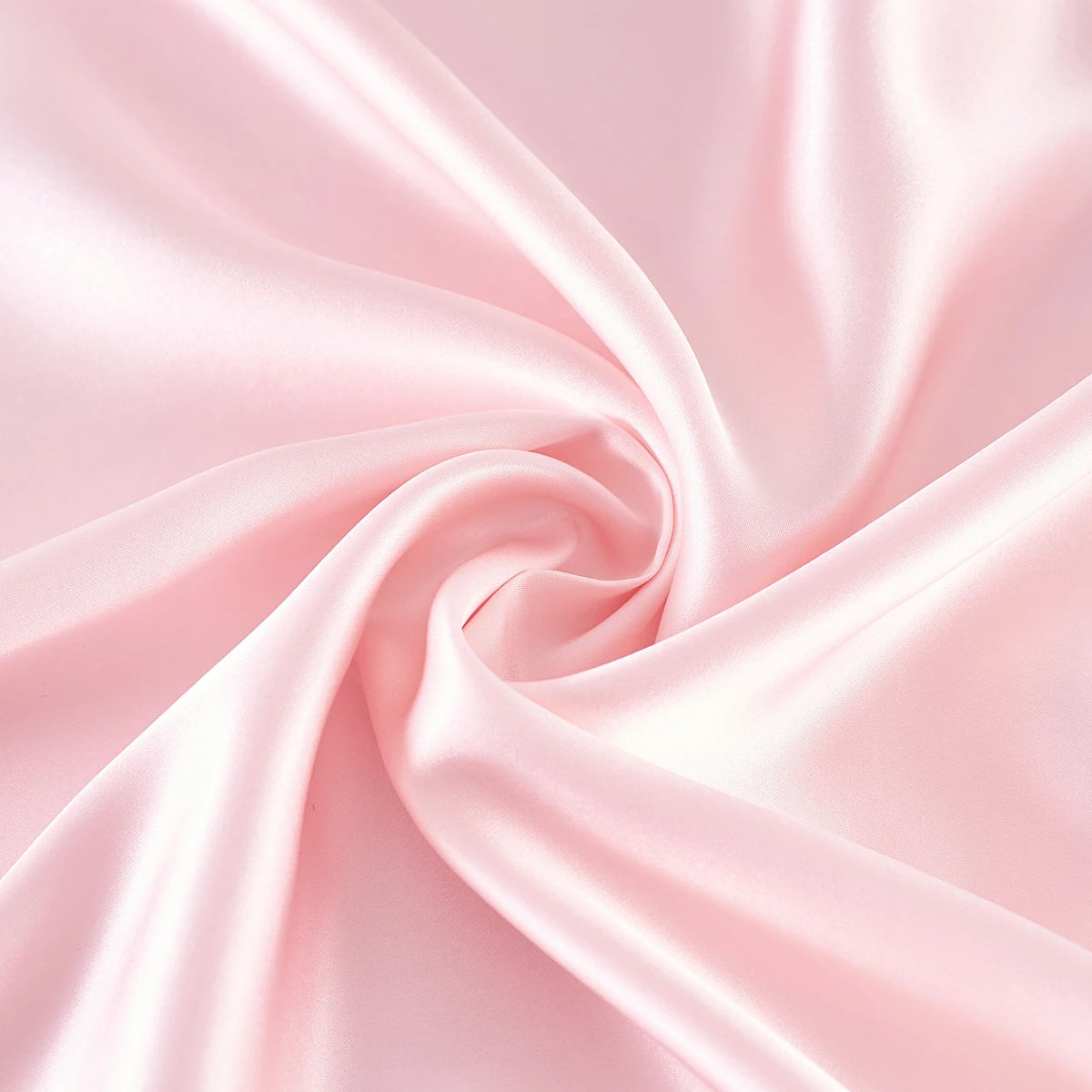Pink satin fabric with a swirl pattern