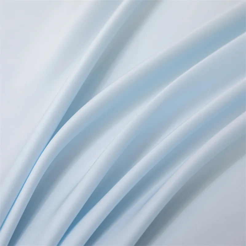Close-up of light blue fabric with soft folds