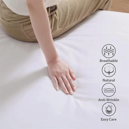 Person touching a mattress with icons indicating features like breathable, natural, anti-wrinkle, and easy care.