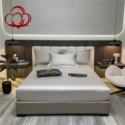 Modern bedroom with a bed, nightstands, and decorative elements.