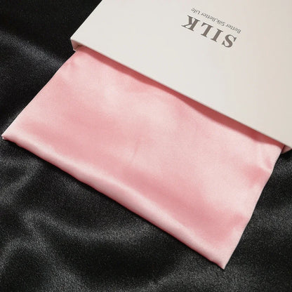 Pink satin fabric with a white box labeled 'Silk' on a black background