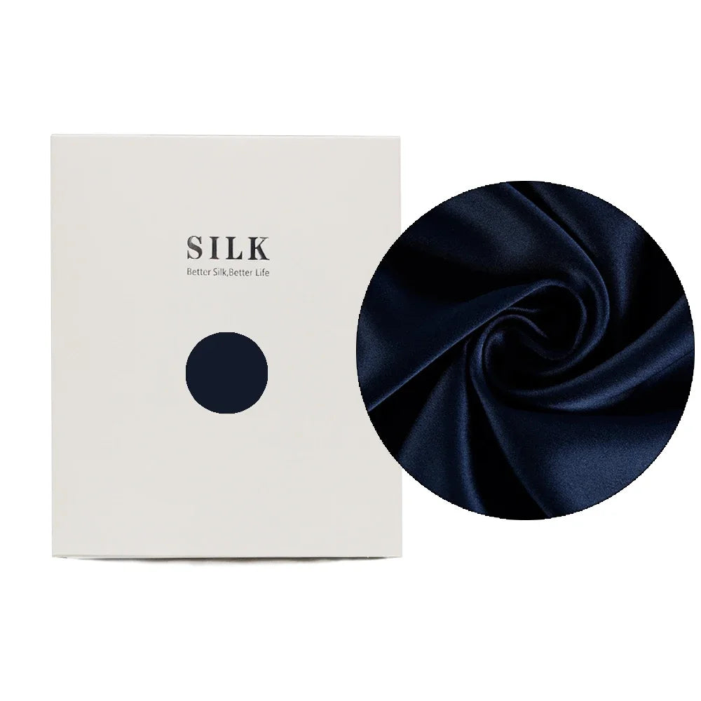 Navy blue silk fabric with a close-up on a white background