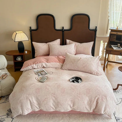Bedroom with pink bedding and a wooden headboard