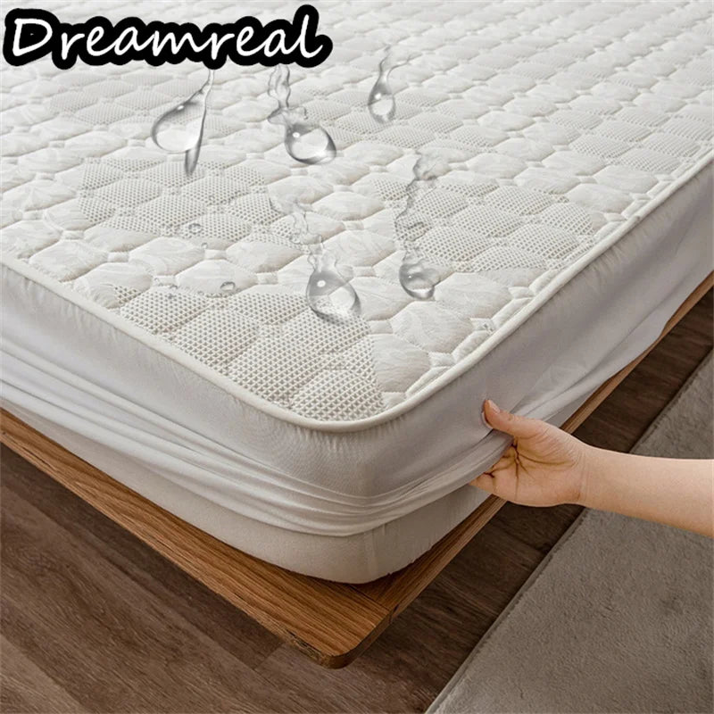 Mattress protector with a hand holding it, showing its size and fit on a bed.