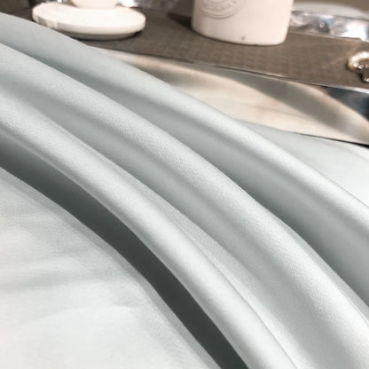 Close-up of a gray fabric with a kitchen sink in the background