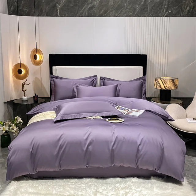 Purple bedding set on a bed in a stylish bedroom with marble walls and modern decor.