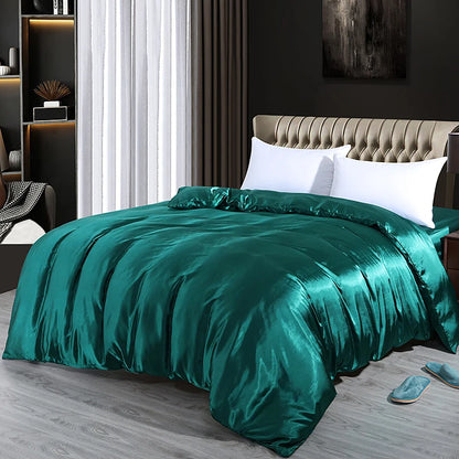 Teal satin comforter set on a bed in a bedroom with a dark wall and white curtains.