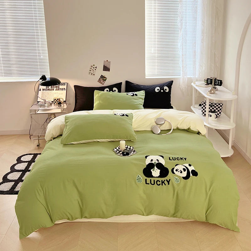 Bedroom with green bedding featuring panda bears and 'Lucky' text.