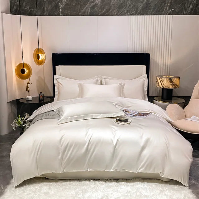 Neatly made bed in a modern bedroom with marble wall and decorative lamps.