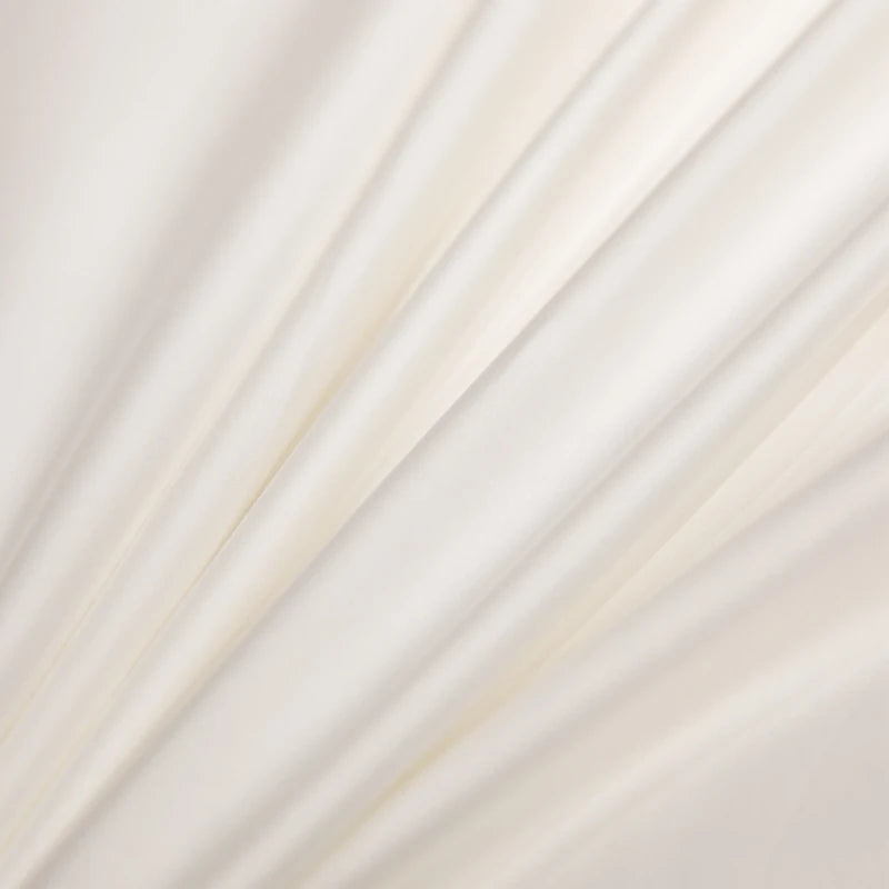 Close-up of white fabric with subtle texture