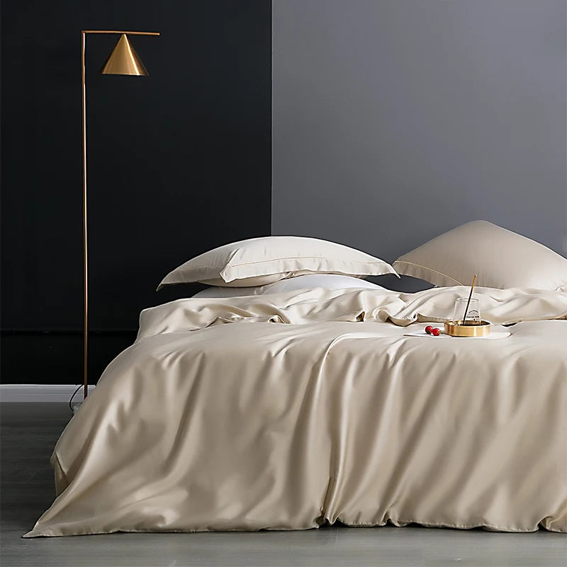 Neatly made bed with beige bedding in a modern bedroom setting.