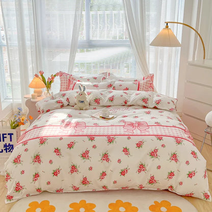 Floral patterned bedding set on a bed in a bright bedroom.