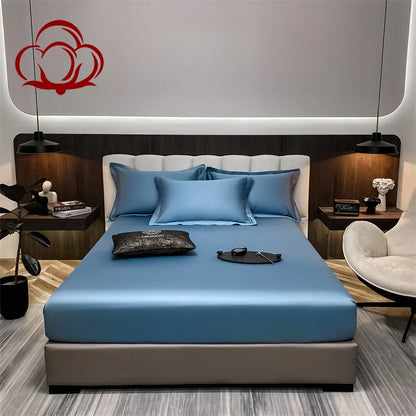 Modern bedroom with a bed featuring blue bedding and a decorative headboard.