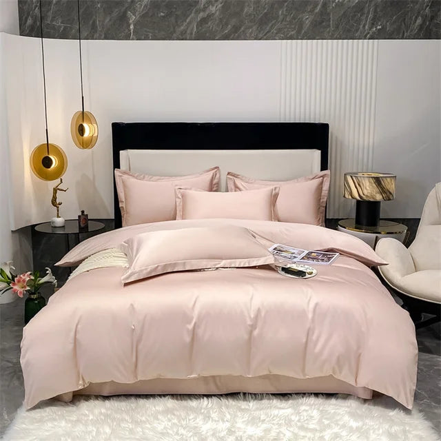Neatly made bed with pink bedding in a modern bedroom setting.