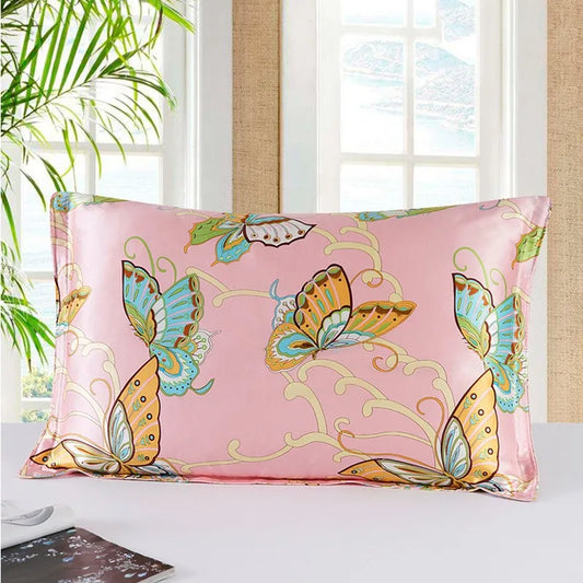 Pink pillowcase with butterfly design on a bed in a bright room.