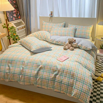 Bed with checkered bedding in a bedroom setting