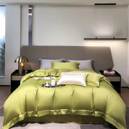 Bedroom with green bedding and gray headboard