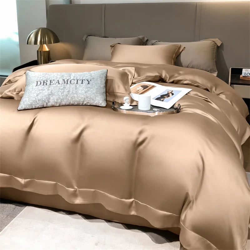 Beige bedding set on a bed with a 'Dreamcity' pillow in a bedroom setting.