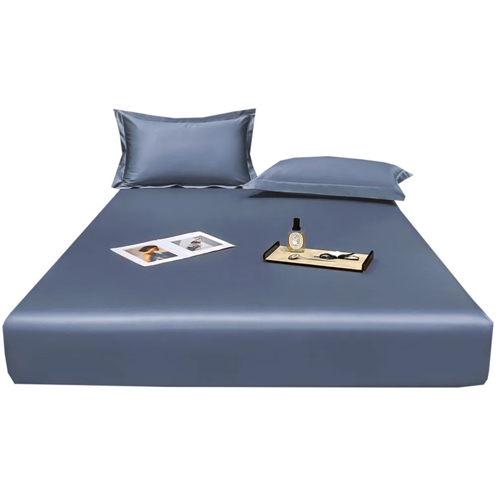 Blue bed sheet set with pillows on a white background