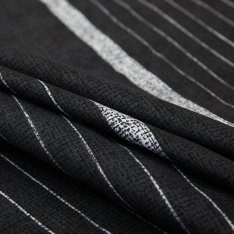 Close-up of black fabric with white stripes and texture details