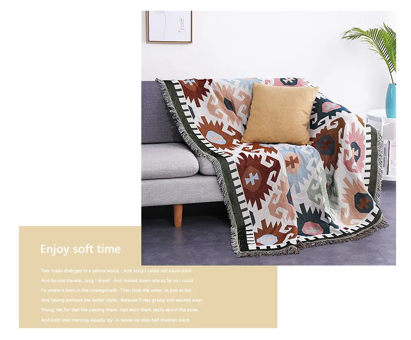 Decorative blanket with geometric pattern on a couch, with text 'Enjoy soft time' on a beige background.