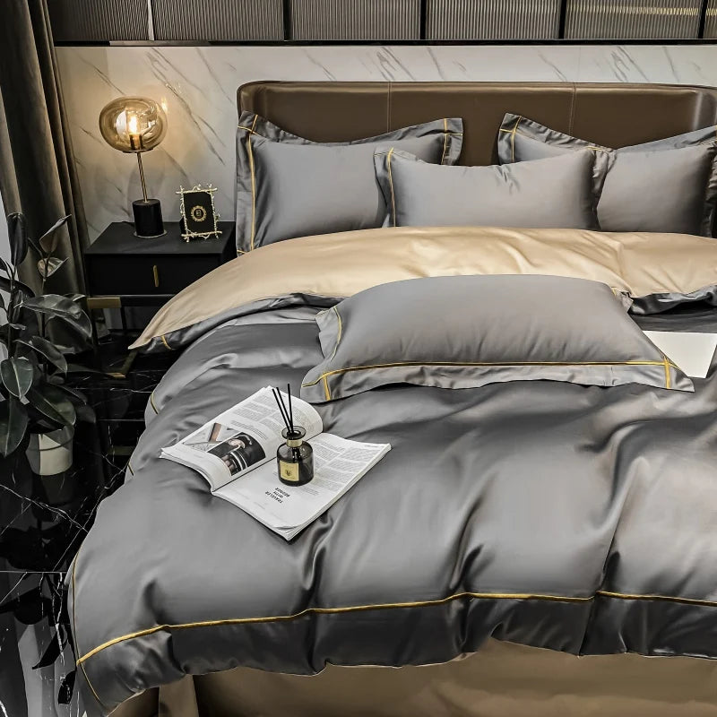 Gray and beige bedding set on a bed in a stylish bedroom.
