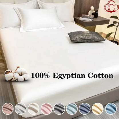 Bed with white bedding and decorative pillows, featuring '100% Egyptian Cotton' text and color swatches.