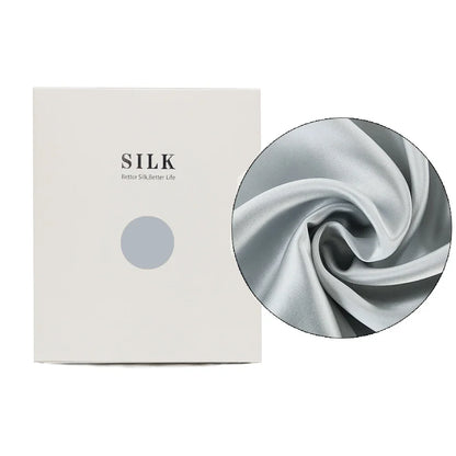 Silk product packaging with a close-up of silk fabric on a white background