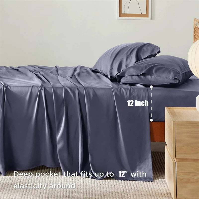 Gray bed sheets with deep pocket feature on a bed in a bedroom setting.
