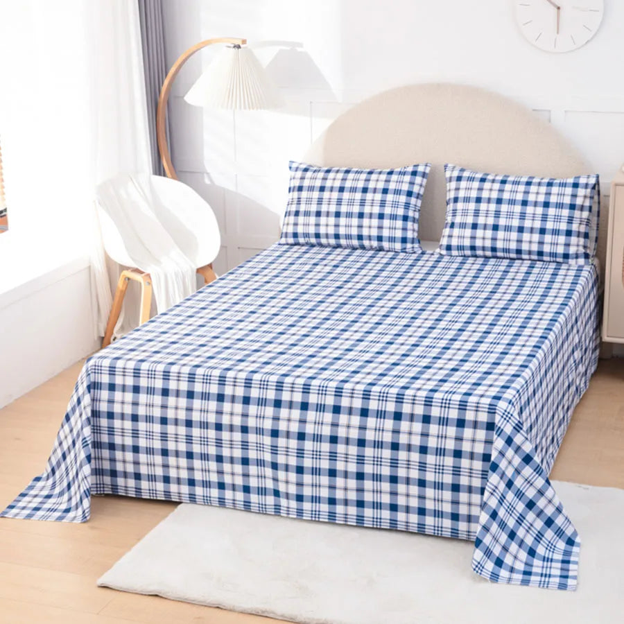 Blue and white checkered bedspread on a bed in a bedroom setting