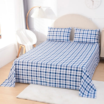 Blue and white checkered bedspread on a bed in a bedroom setting