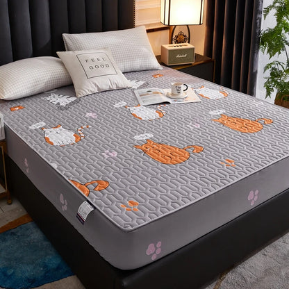 Gray mattress cover with cat pattern on a bed in a bedroom setting