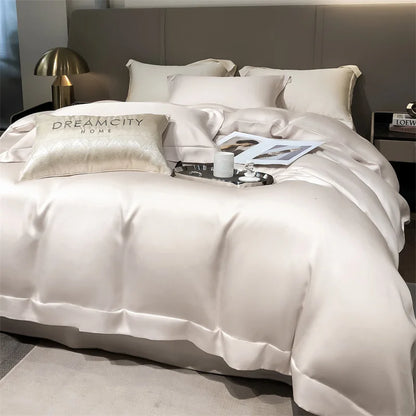Neatly made bed with white bedding and pillows, featuring 'Dream City Home' branding.
