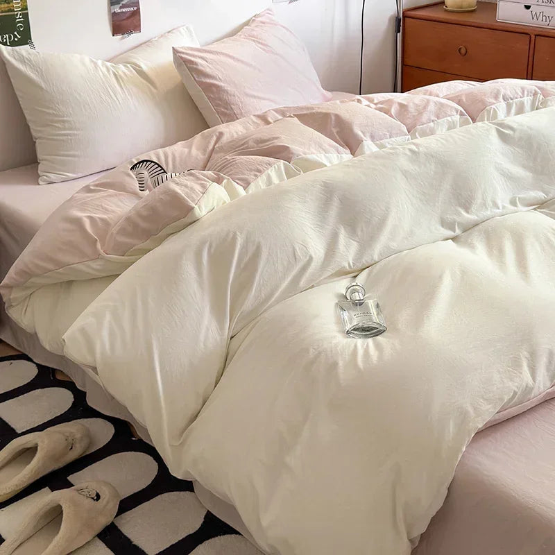 Beige comforter on a bed with pillows in a bedroom setting