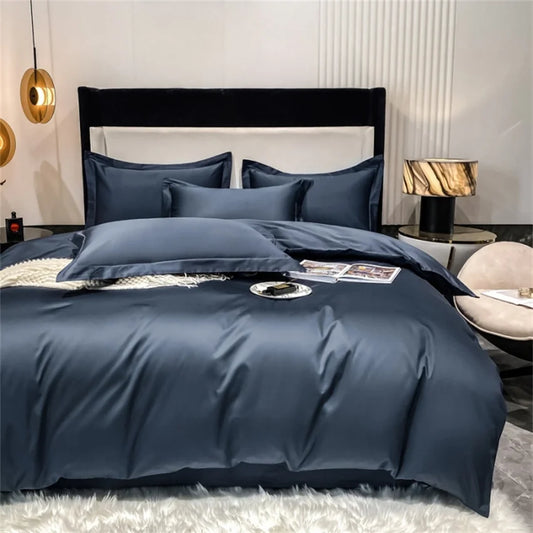 Navy blue bedding set on a bed in a modern bedroom.